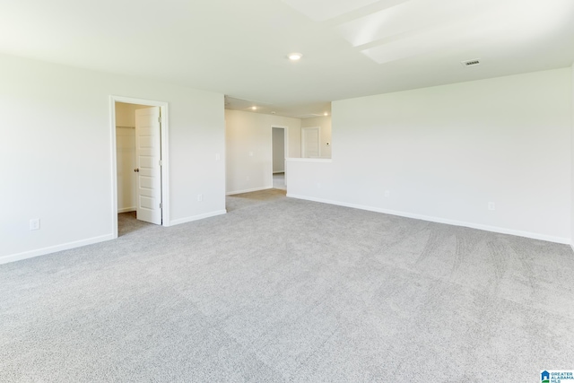 empty room featuring light carpet