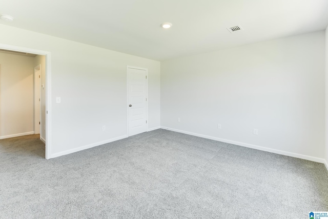 spare room featuring carpet floors