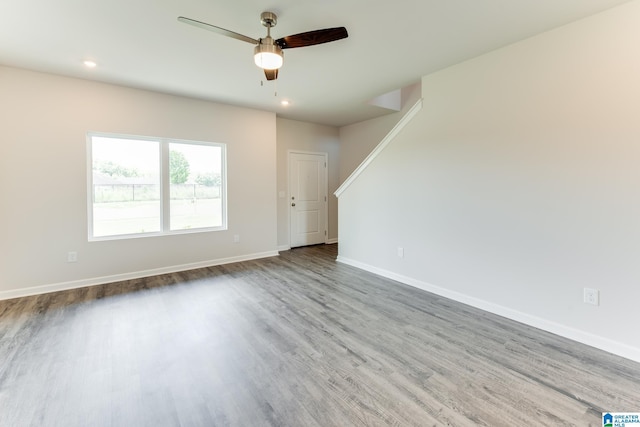 spare room with ceiling fan and hardwood / wood-style floors