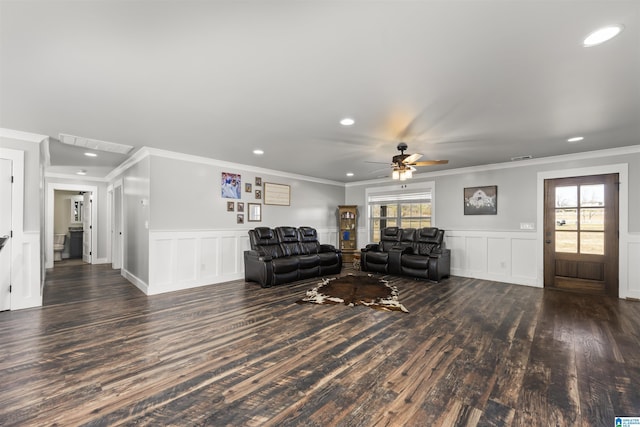 living room featuring ceiling fan, dark hardwood / wood-style floors, and ornamental molding