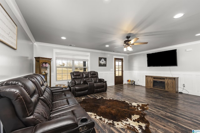 living room featuring ceiling fan, dark hardwood / wood-style floors, and crown molding