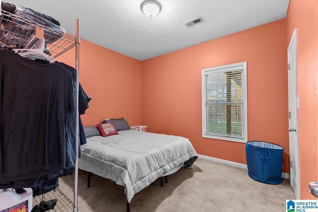 bedroom with light colored carpet