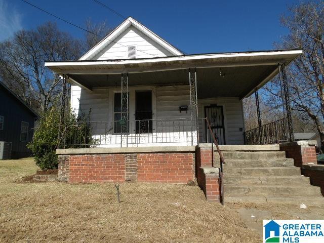 view of front of house with central AC and a porch