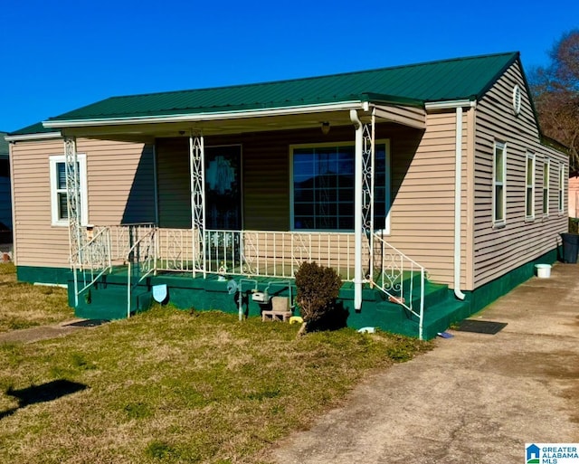 rear view of property featuring a porch