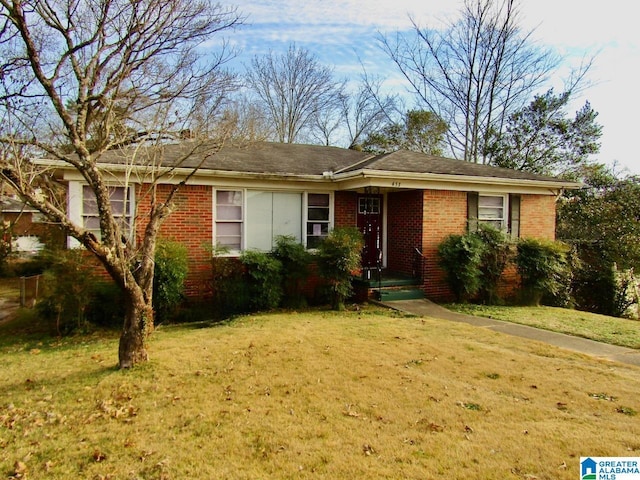 ranch-style home with a front yard