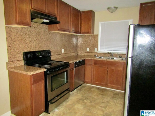 kitchen featuring backsplash, appliances with stainless steel finishes, and sink