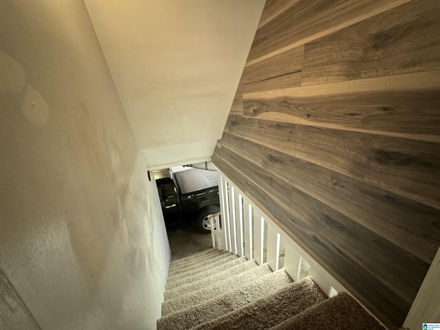 stairs featuring lofted ceiling