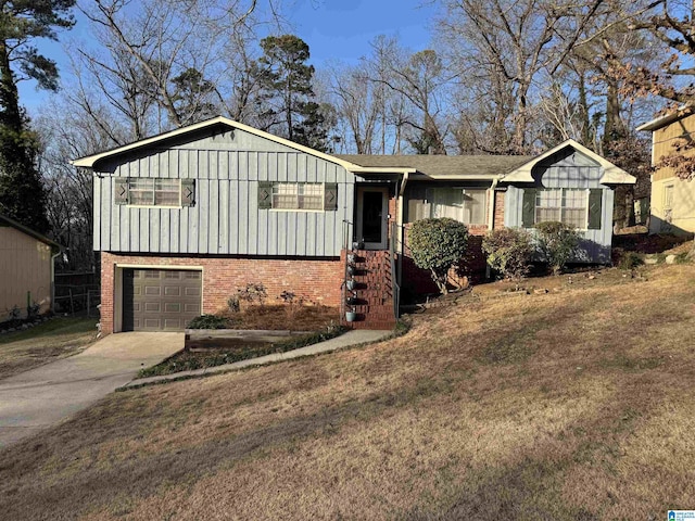 view of front facade with board and batten siding, an attached garage, concrete driveway, and brick siding