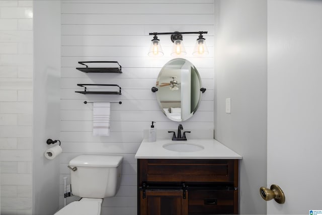 bathroom with toilet and vanity