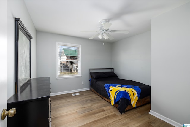 bedroom featuring ceiling fan and hardwood / wood-style floors