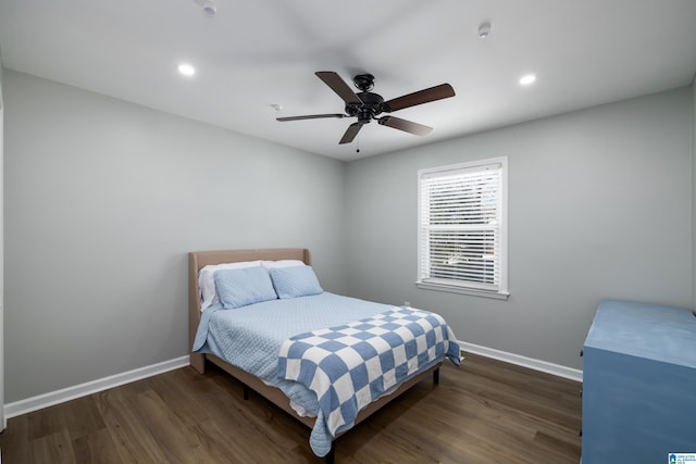 bedroom featuring ceiling fan and dark hardwood / wood-style flooring