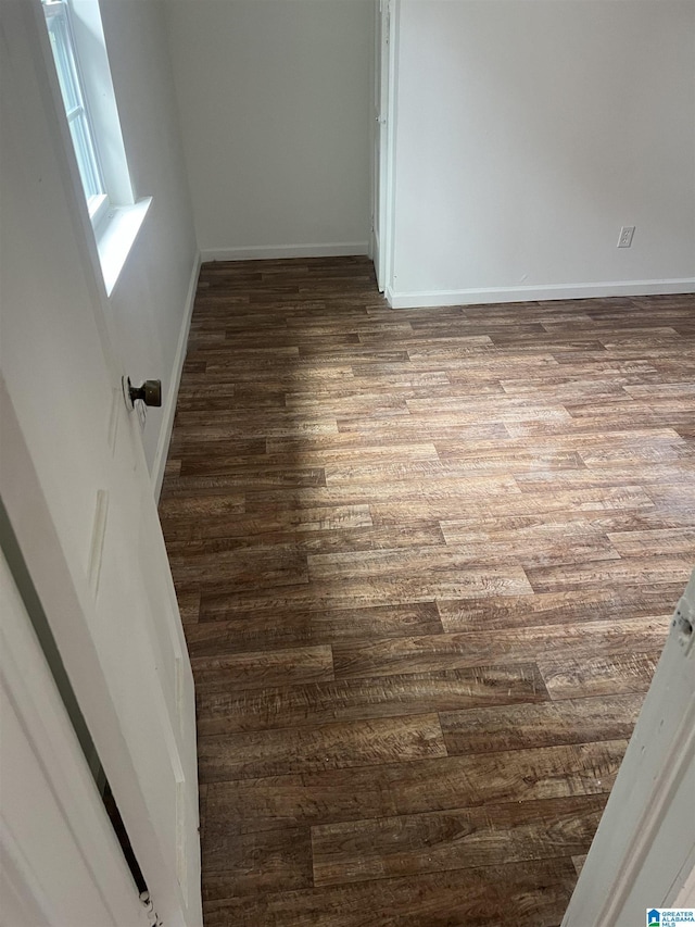 unfurnished room featuring hardwood / wood-style flooring