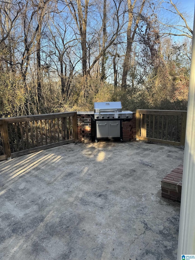 view of patio / terrace featuring an outdoor kitchen and a grill