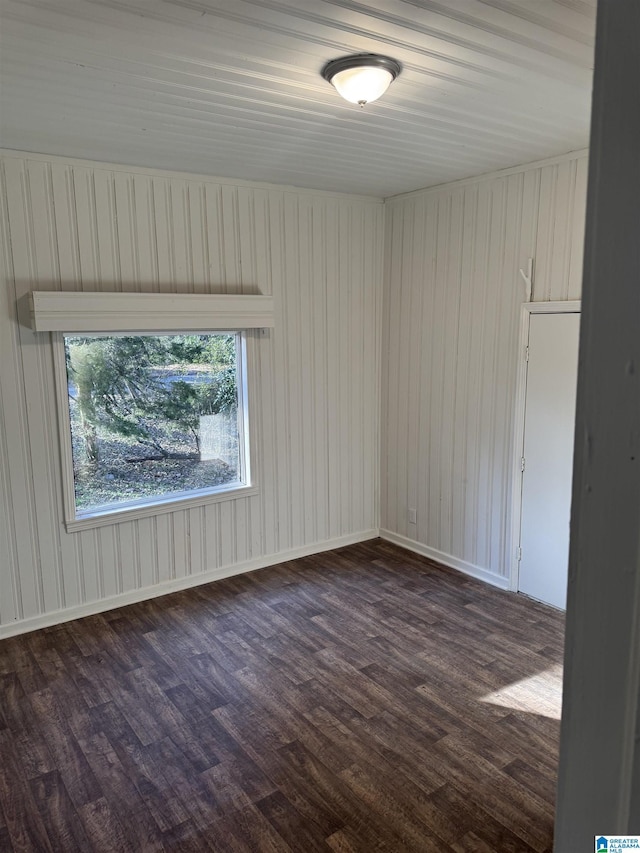 unfurnished room featuring dark hardwood / wood-style floors