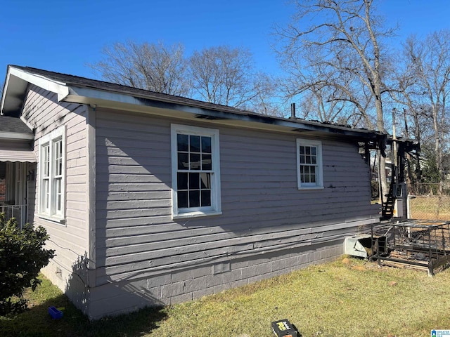 view of home's exterior featuring a lawn