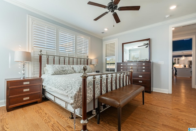 bedroom with light wood-type flooring, ceiling fan, and crown molding