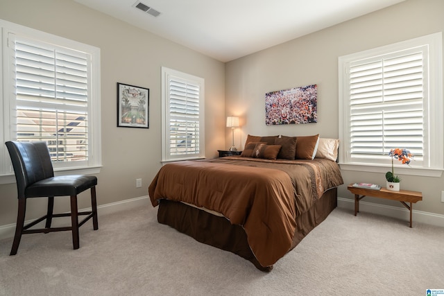 bedroom with light carpet