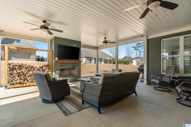 view of patio / terrace featuring exterior fireplace