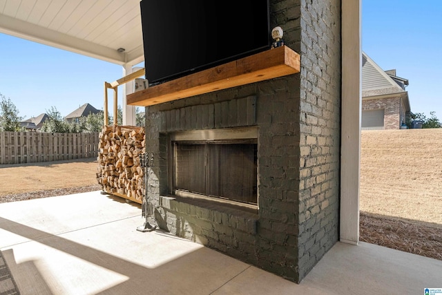 exterior details with an outdoor brick fireplace