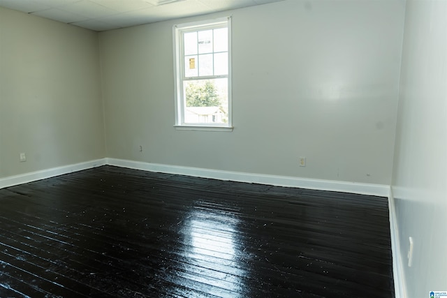 spare room featuring dark hardwood / wood-style flooring