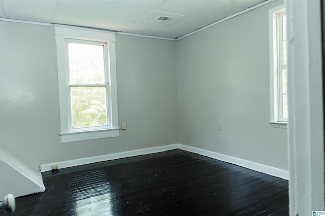 spare room featuring dark hardwood / wood-style floors