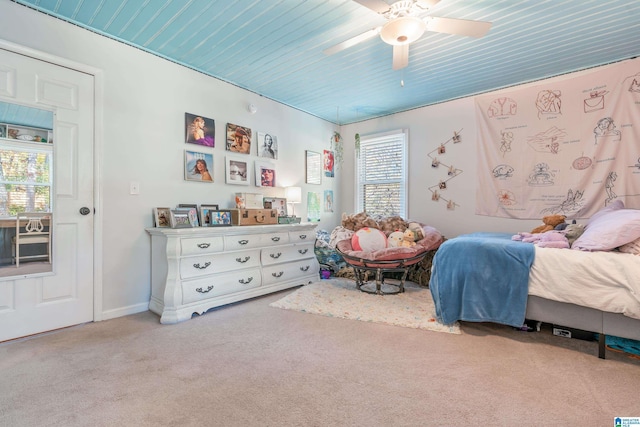 bedroom with ceiling fan and light carpet