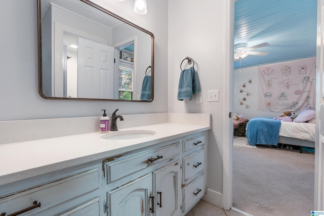 bathroom with ceiling fan and vanity