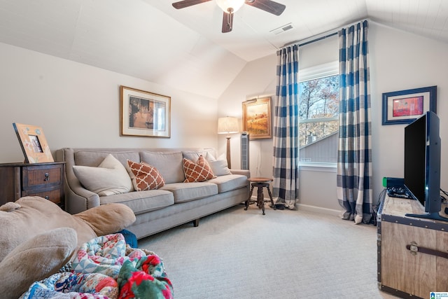 carpeted living room featuring ceiling fan and lofted ceiling