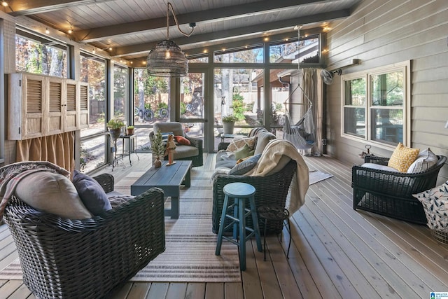 sunroom with vaulted ceiling with beams and wood ceiling