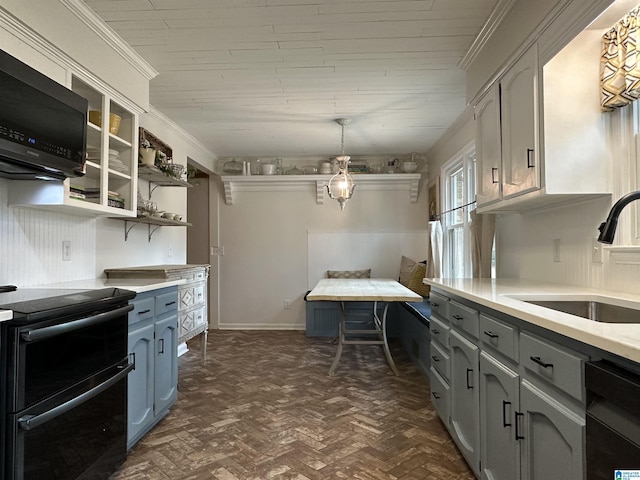 kitchen featuring gray cabinets, sink, black dishwasher, hanging light fixtures, and range with electric stovetop