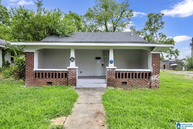 bungalow-style house featuring a front lawn and a porch