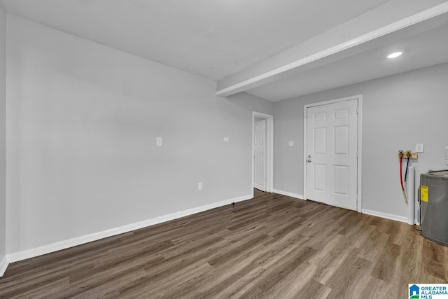 spare room with wood-type flooring