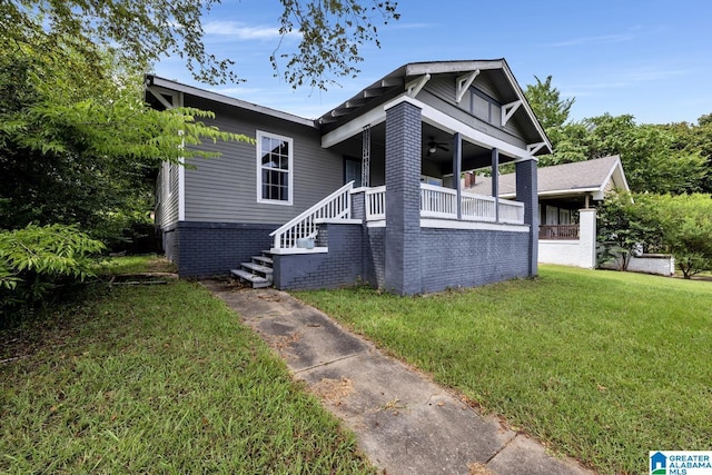 bungalow-style house featuring a front lawn and a porch