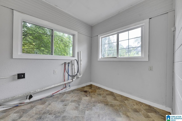 spare room featuring a wealth of natural light