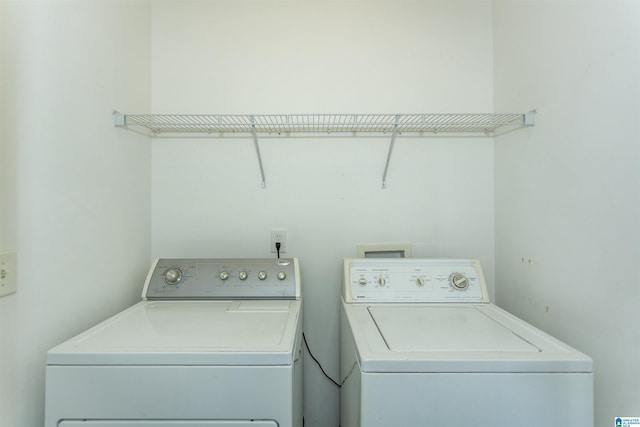 laundry room with washer and clothes dryer