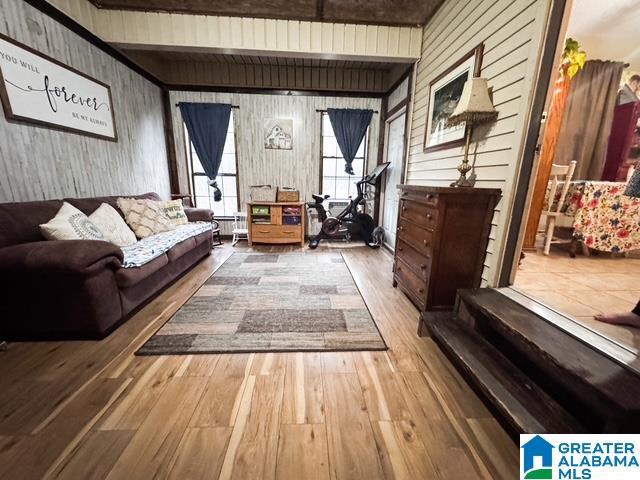 interior space featuring wood walls and hardwood / wood-style flooring