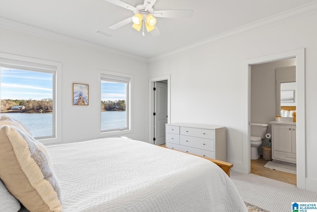 250 Williams Rd, Alexander City, AL 35010 - carpeted bedroom featuring ceiling fan, ensuite bathroom, a water view, and ornamental molding