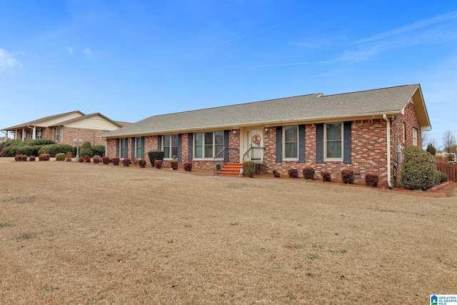 ranch-style home with a front lawn