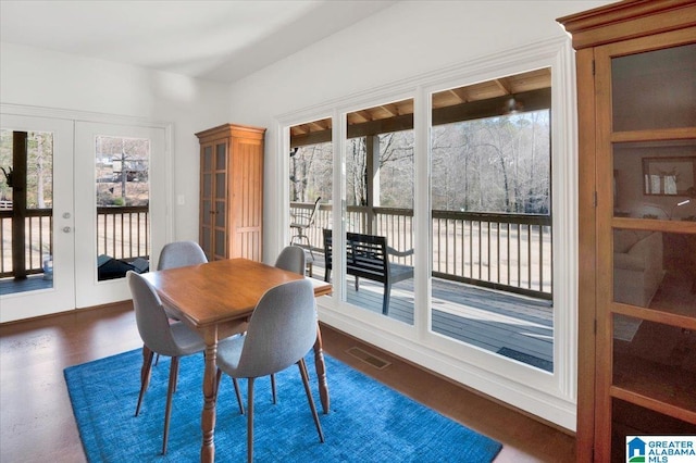 dining room featuring french doors and a healthy amount of sunlight