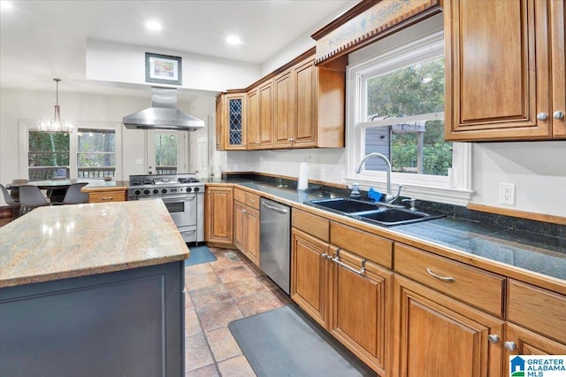 kitchen with sink, island range hood, appliances with stainless steel finishes, a kitchen island, and pendant lighting