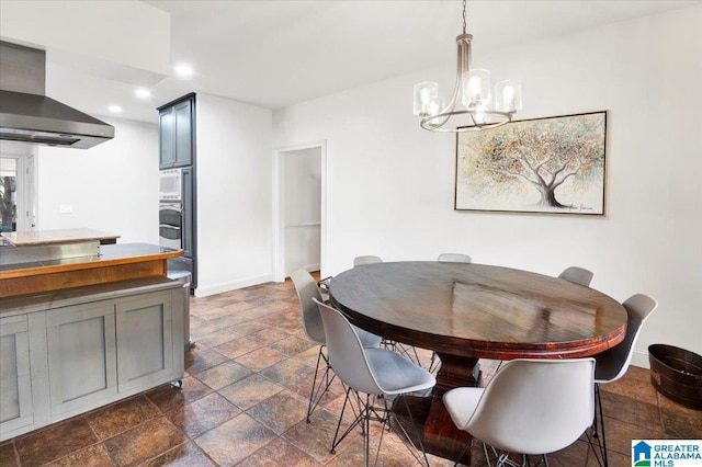 dining room with a notable chandelier