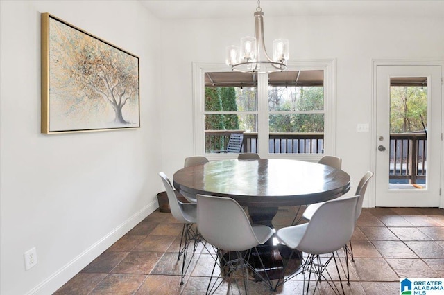 dining space featuring a notable chandelier