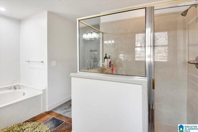 bathroom featuring shower with separate bathtub