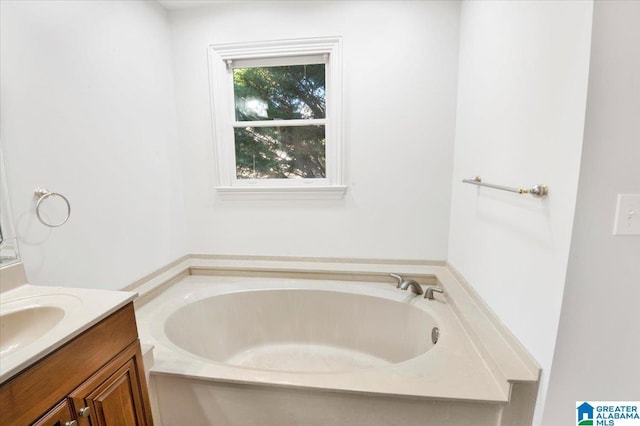 bathroom with vanity and a bathing tub