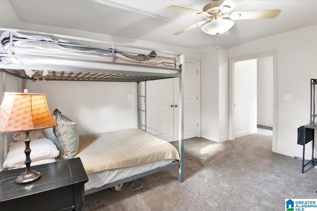 bedroom with ceiling fan and light carpet