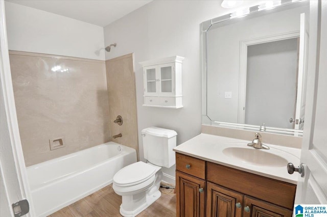 full bathroom with shower / bathing tub combination, vanity, hardwood / wood-style flooring, and toilet