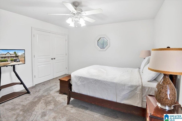 bedroom featuring ceiling fan and light colored carpet