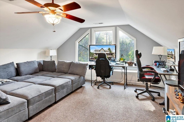 home office featuring lofted ceiling, carpet floors, and ceiling fan