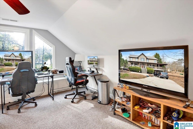 carpeted office space with vaulted ceiling