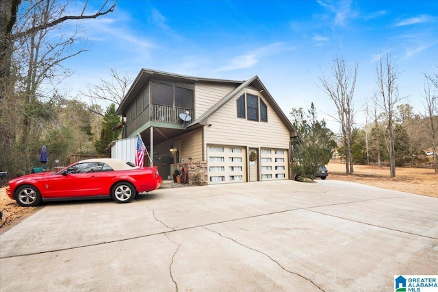 view of side of home featuring a garage